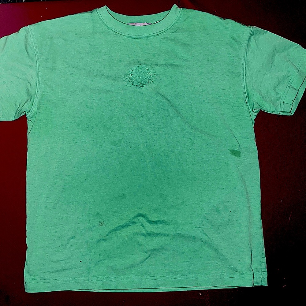 Green shirt with a stain i’m tryna remove not noticeable until pointed out tho.